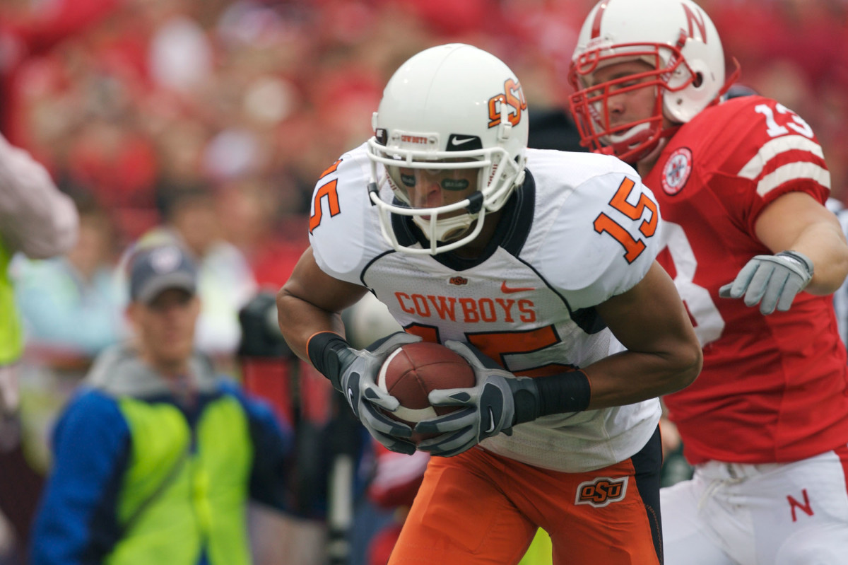 Seth Newton dives into the end zone for one of the Cowboys’ five touchdowns during the 38-0 first half.